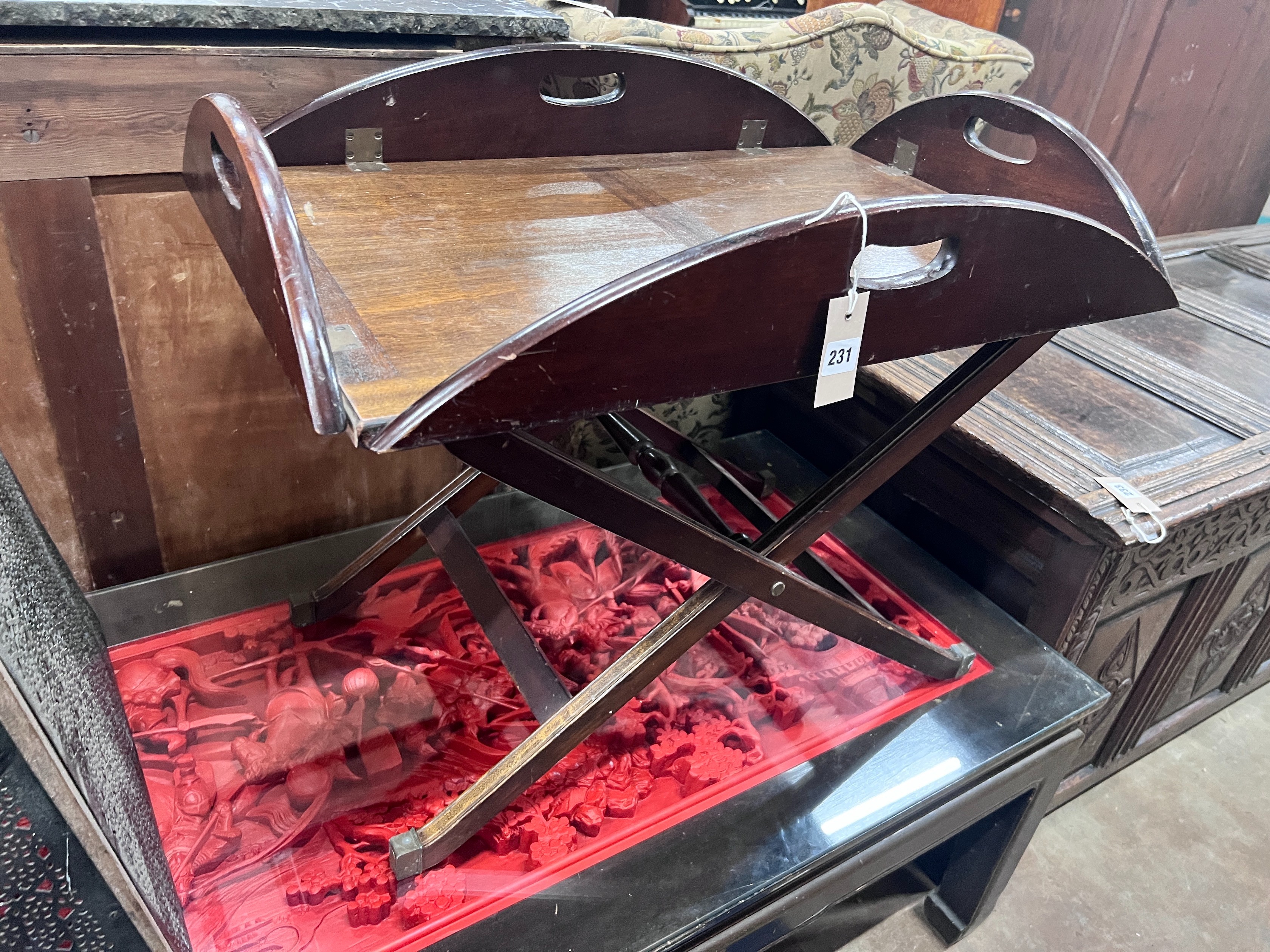 A mahogany butler's tray on folding stand, width 70cm *Please note the sale commences at 9am.